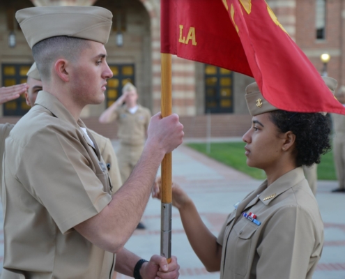 Photo of two Midshipmen exchanging command for the new term.